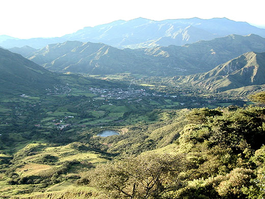 Vilcabamba village, nestled between tall Andean peaks 