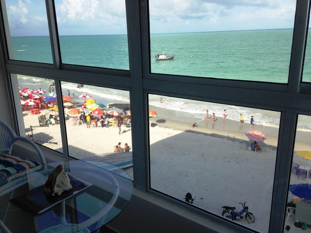 A window view of the beachfront from the interior of a Morado do Sol condo