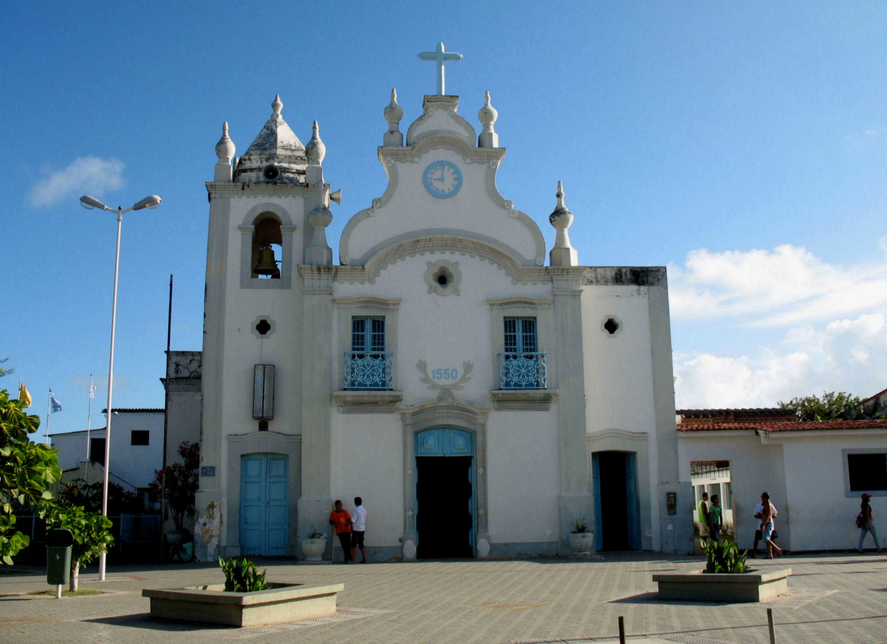 A view of Itamaraca's local church from the front of the building in a town square