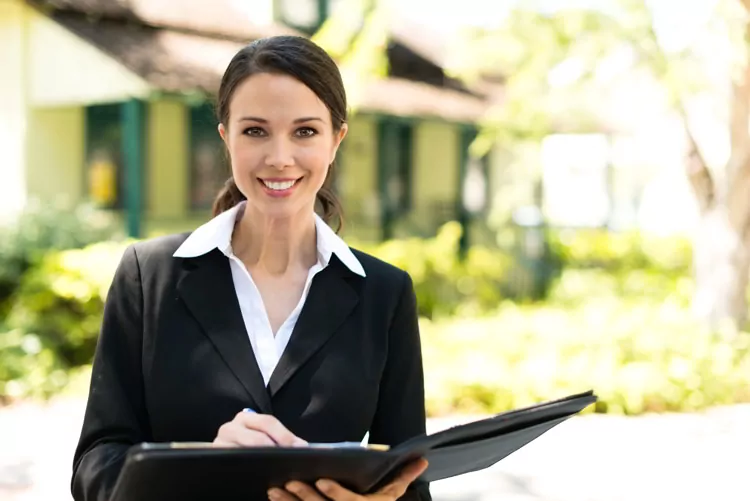 Real estate agent broker with bungalow house in background