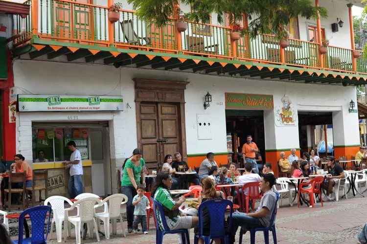 Outdoor cafe in main square in small town Sabaneta, Medellin, Colombia
