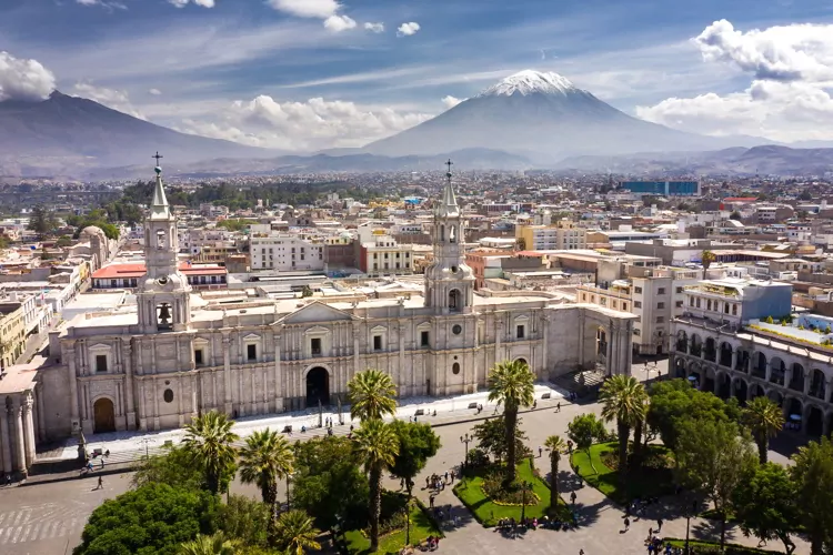 Aerial drone view of Arequipa main square and cathedral church, with the Misti volcano as background.