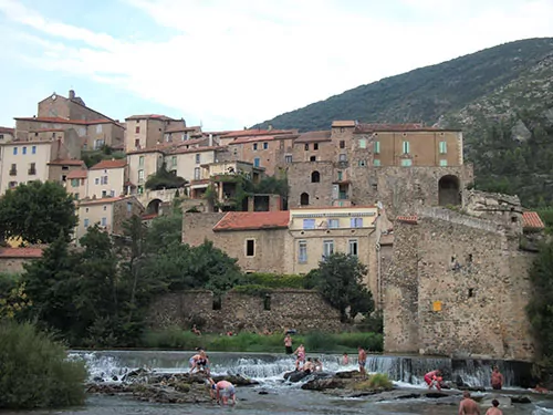 The village of Roquebrun and its popular river beach