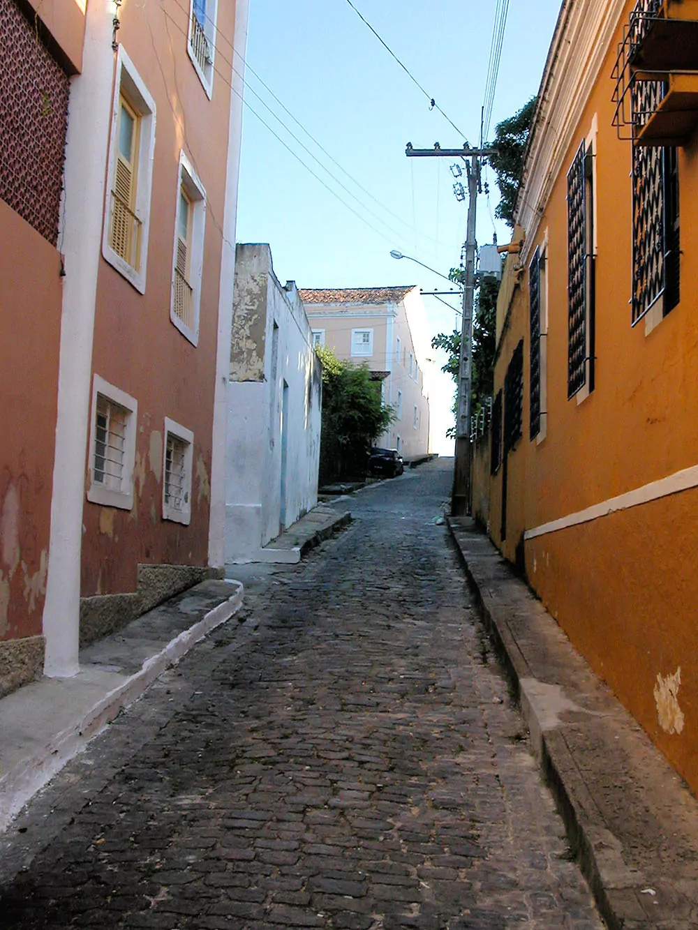 Colorful buildings in a cobblestone alleyway in Olinda Brazil