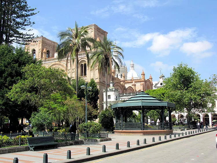 a plaza with a cathedral and gazebo in Cuenca