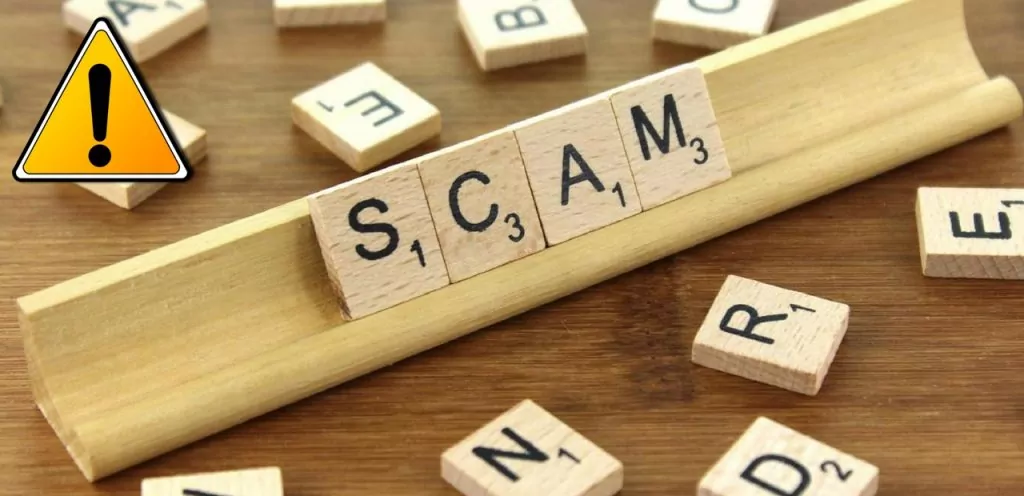 property scams scrabble tiles spell scam