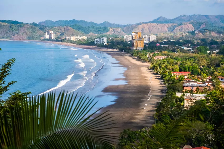 beach houses and apartments on a tropical beach in costa rica