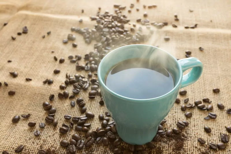 Coffee cup and coffee beans