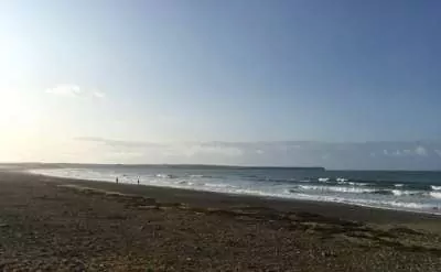 Tramore beach in Ireland at high tide