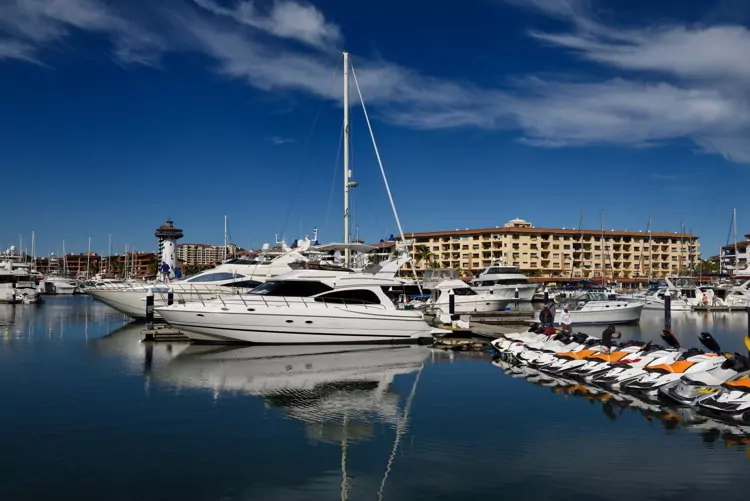 Yachts and water scooters docked at the Puerto Vallarta Marina in Mexico