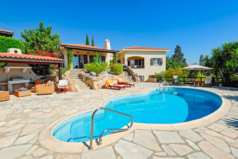 Private swimming pool and patio area outside Cyprus villa.