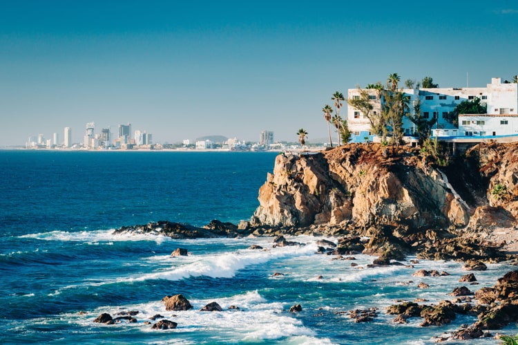 View of cliffs, the Pacific ocean and the touristic part of Mazatlan, Sinaloa, Mexico