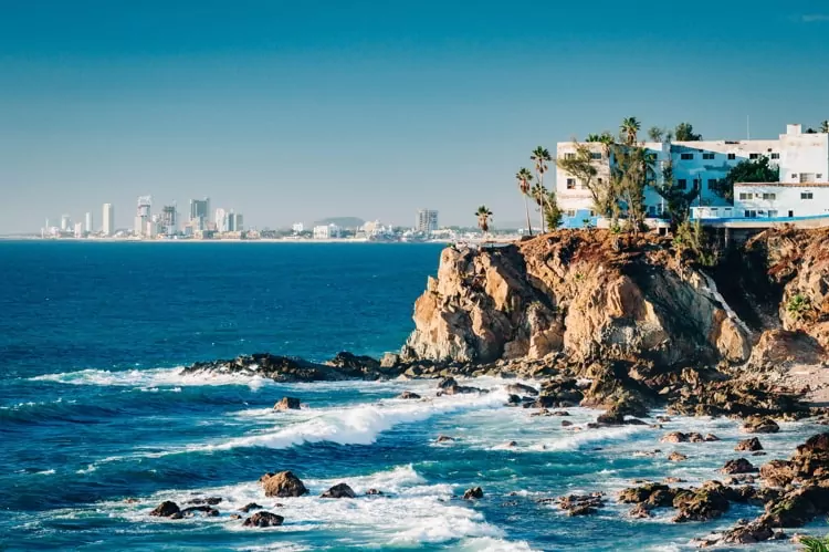 View of cliffs, the Pacific ocean and the touristic part of Mazatlan, Sinaloa, Mexico