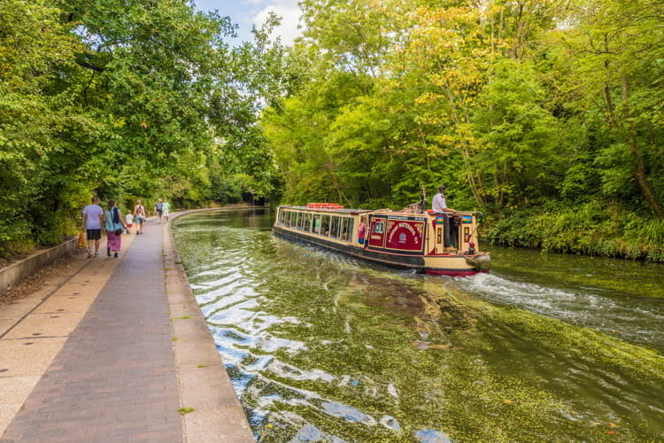 A canal with a houseboat in London