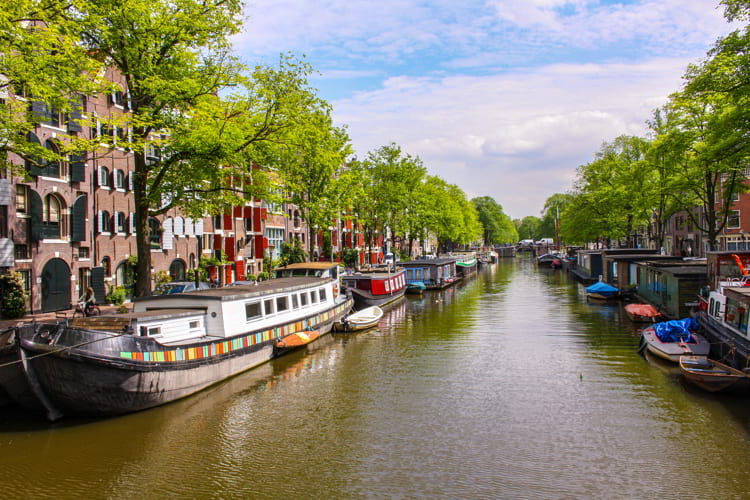 Amsterdam Canals with houseboats and houses