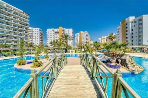 A wooden bridge on a pool on a resort in Northern Cyprus