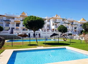 A housing complex in Conil, Spain with a pool