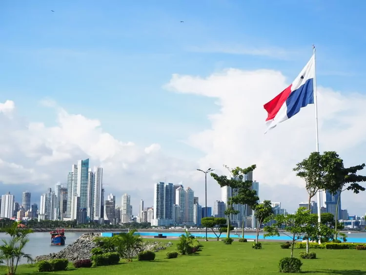 Skyline with green grass and flag in Panama City, Panama