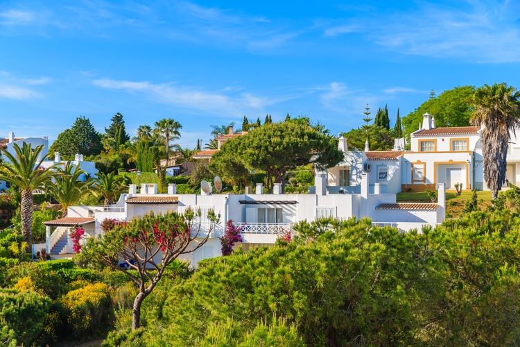 Garden with typical holiday apartments in Carvoeiro town, Algarve region, Portugal Property