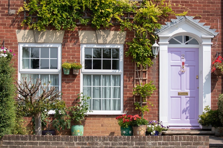 An old brick house with flowers