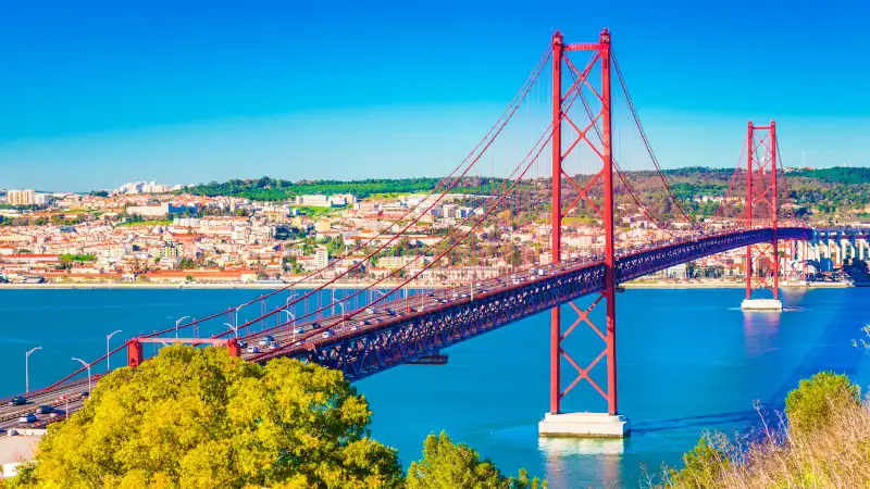 The 25th April Bridge (Ponte 25 de Abril) in Lisbon, Portugal. View from Almada