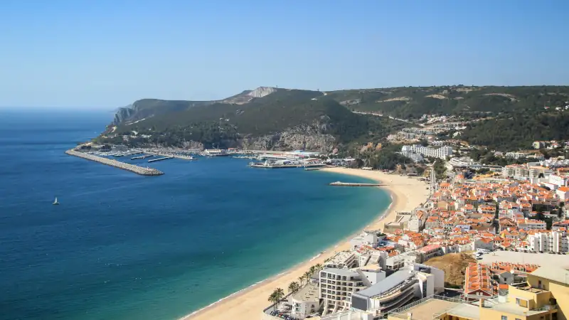 Beautiful view of Sesimbra beach in Portugal at the sunset