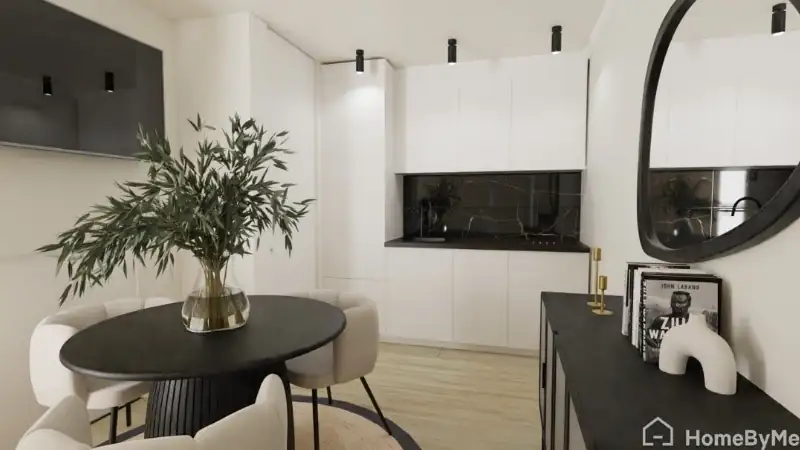 Modern minimalist kitchen with white cabinetry, black countertops, a round dining table, and contemporary décor.