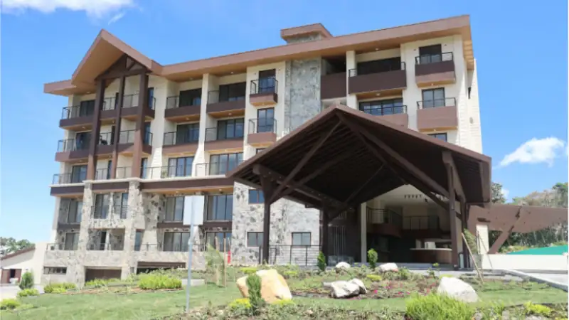 Contemporary mountain resort with landscaped gardens, stone architecture, and panoramic views in Boquete.