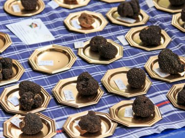 black truffles on gold plates